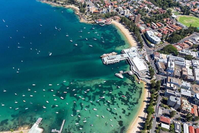 an aerial view of a harbor with boats in the water at Manly Moon in Sydney