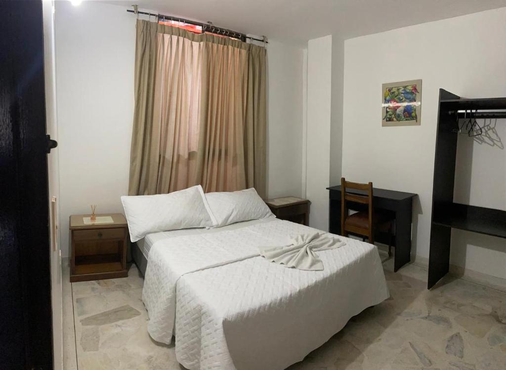 Una cama o camas en una habitación de HOTEL EJECUTIVO PITALITo