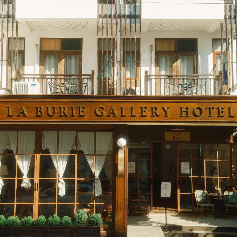 a building with a sign that reads la buire gallery hotel at LA BURIE HOTEL Chiang Mai in Chiang Mai