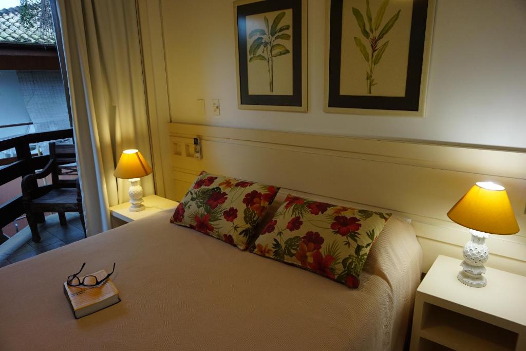 Cama ou camas em um quarto em Pousada Terra Juquehy
