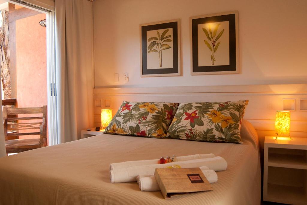 Cama ou camas em um quarto em Pousada Terra Juquehy
