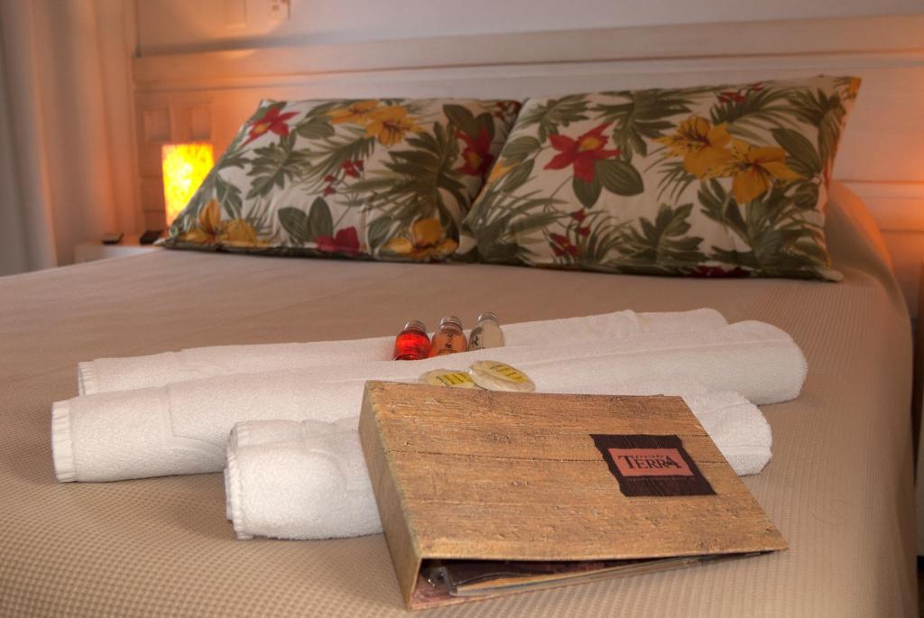 Cama ou camas em um quarto em Pousada Terra Juquehy