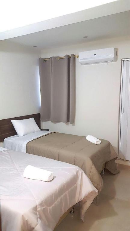 Postel nebo postele na pokoji v ubytování Hotel Sur Brasil