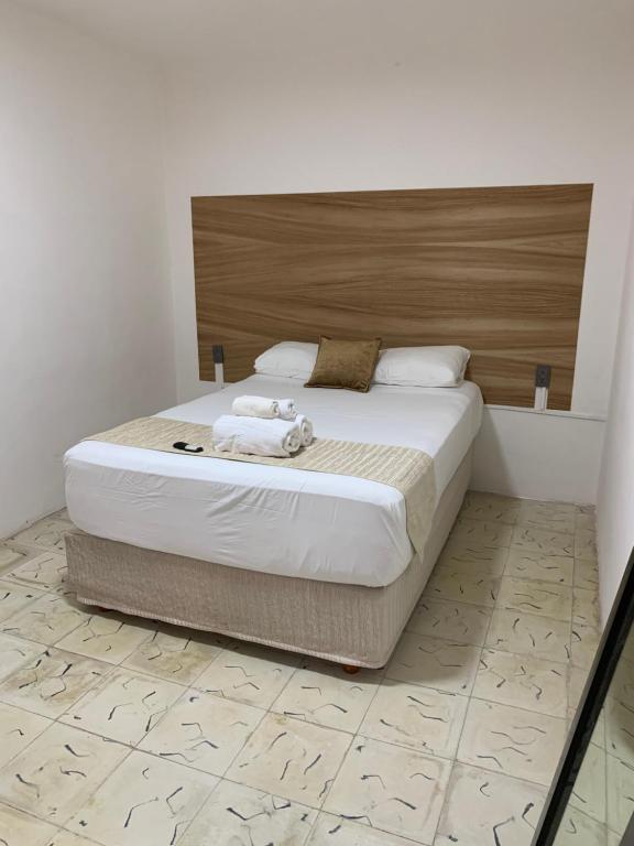 A bed or beds in a room at Casa Palmeras