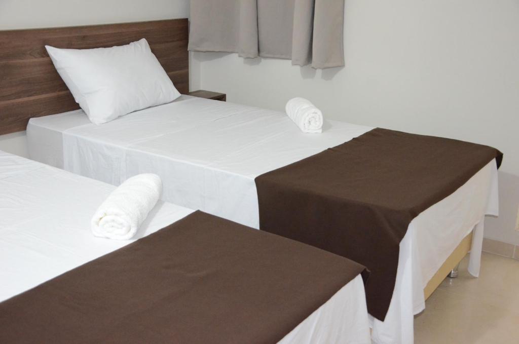 Postel nebo postele na pokoji v ubytování Hotel Sur Brasil