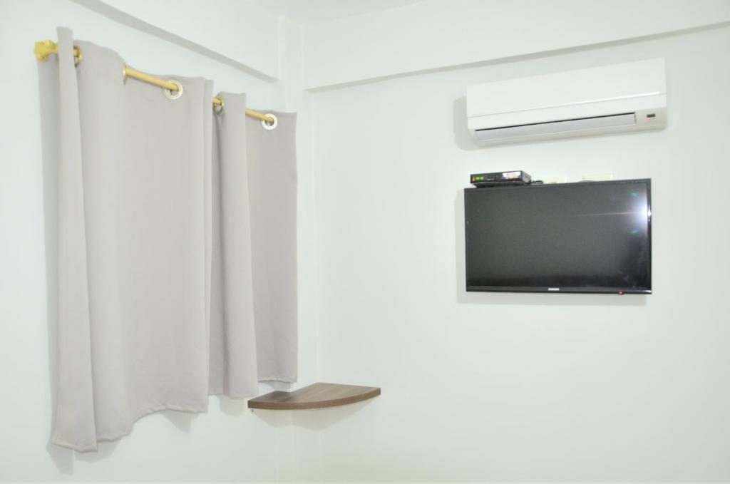 TV a/nebo společenská místnost v ubytování Hotel Sur Brasil