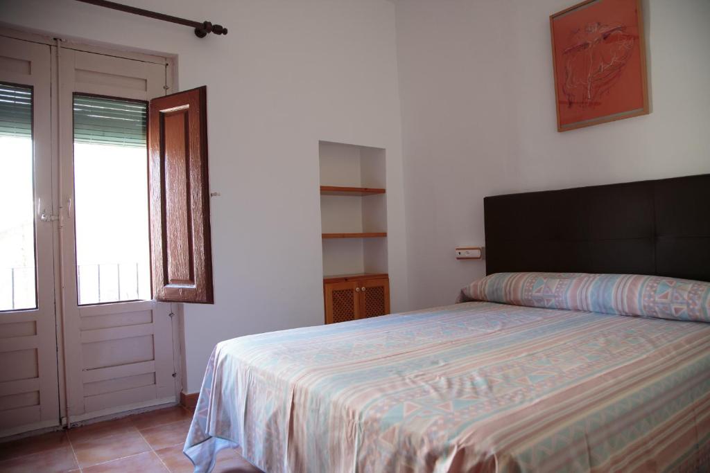 Postel nebo postele na pokoji v ubytování Casa del Mesoncico