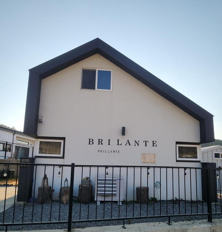 a white building with the words berliniane on it at Paju Espacio Brillante in Paju