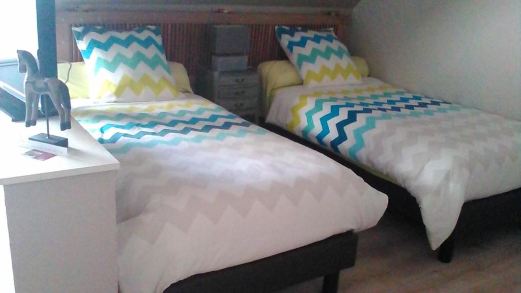 Postel nebo postele na pokoji v ubytování B&B Haras de la Cour Fleury