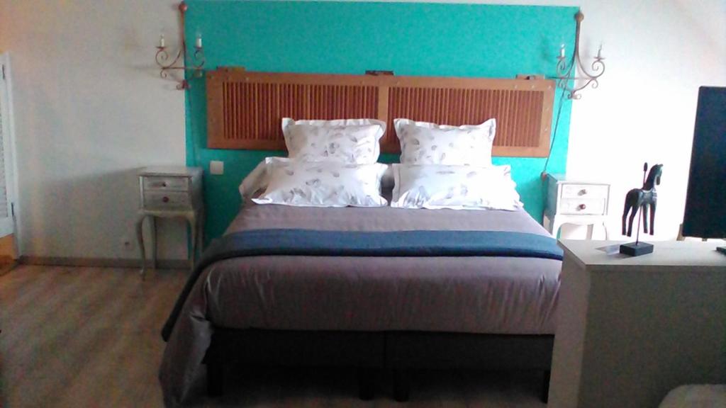 Postel nebo postele na pokoji v ubytování B&B Haras de la Cour Fleury