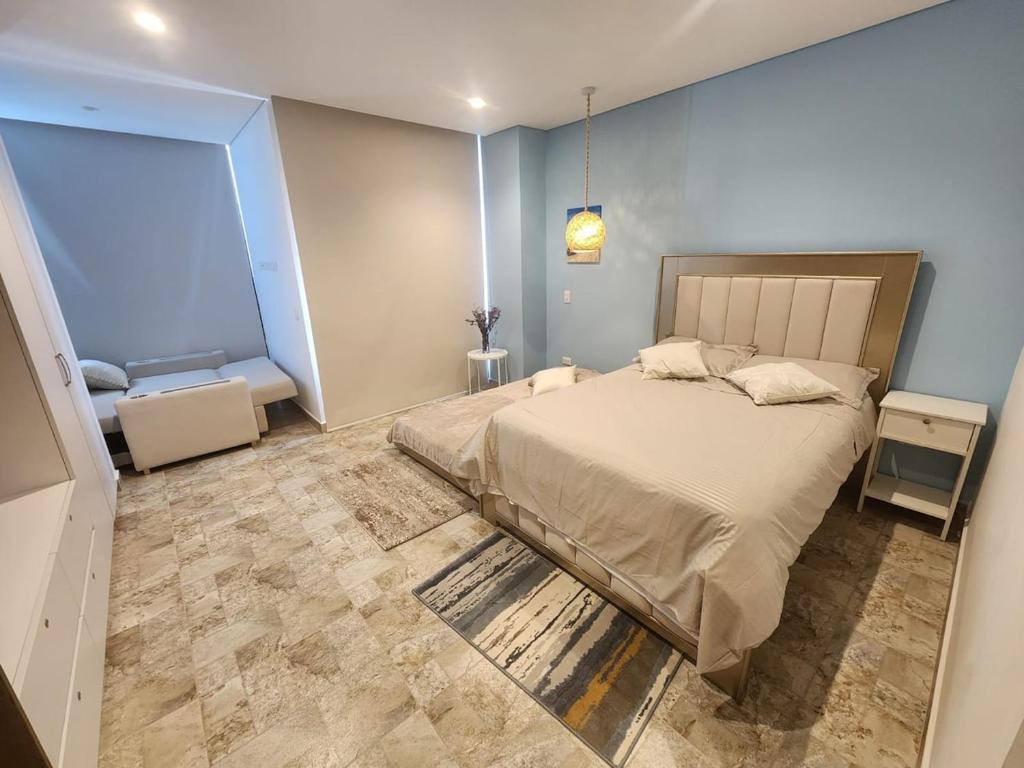 En eller flere senge i et værelse på Suite Blue - Rodadero Sur