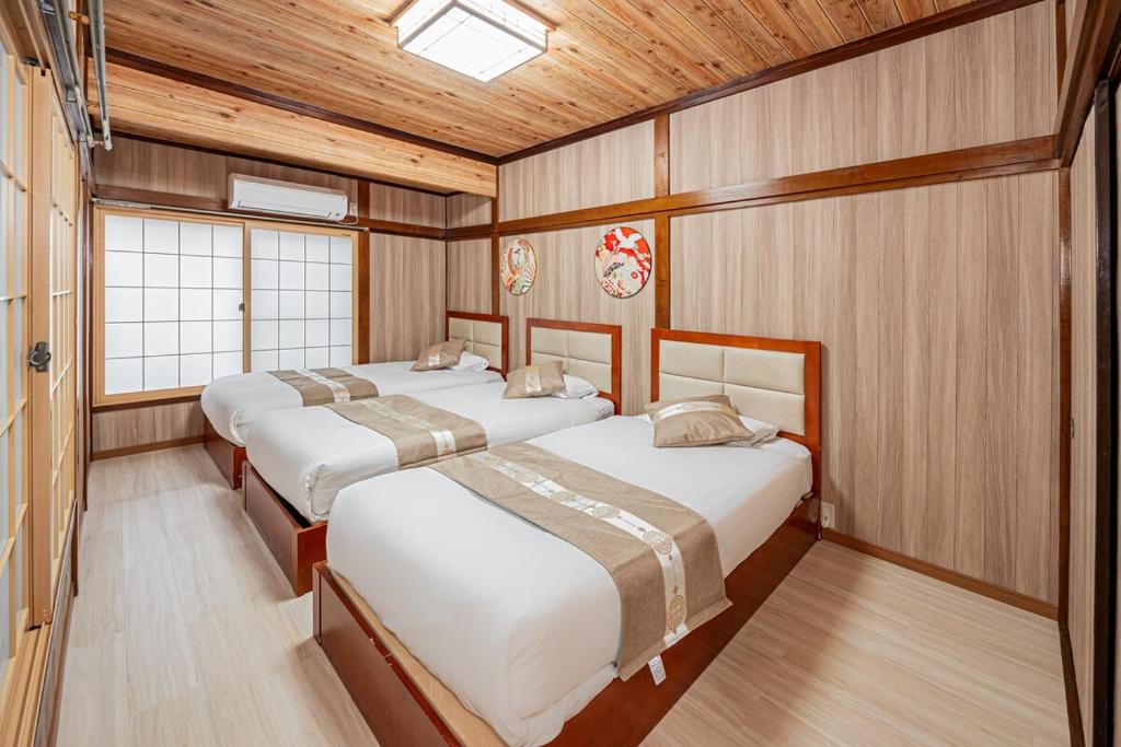 Voodi või voodid majutusasutuse Sky Tree Stay Hotel 5 8-minute walk from Yahiro Station 3-minute train ride to Tokyo Skytree Station toas