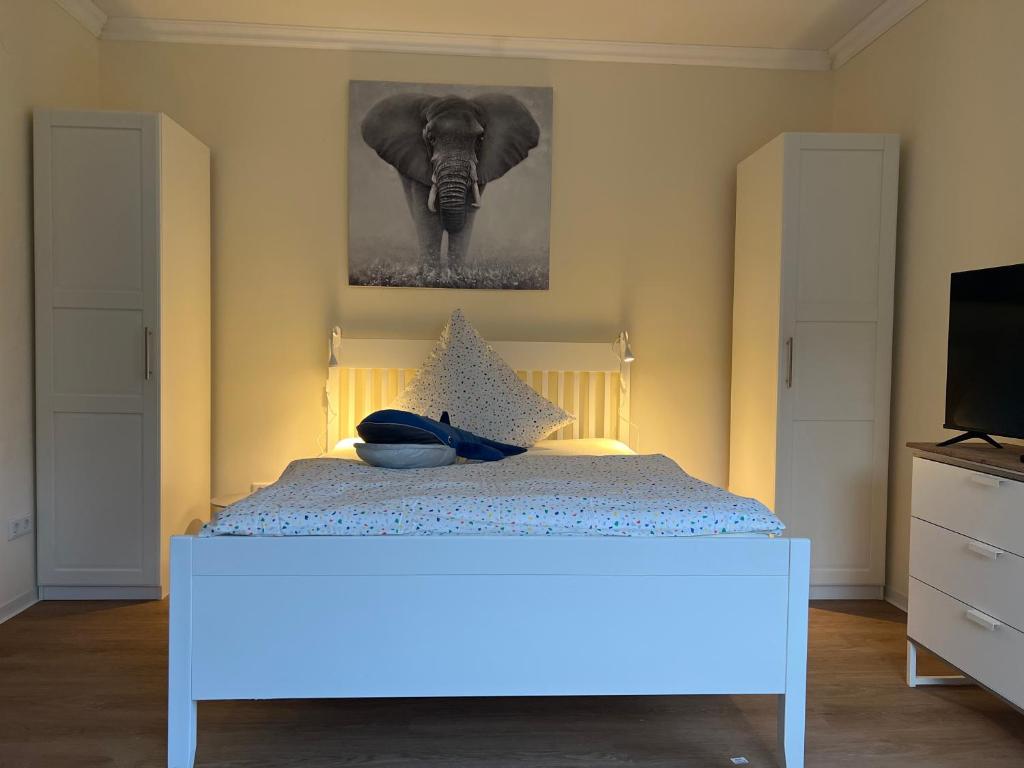 Ένα ή περισσότερα κρεβάτια σε δωμάτιο στο Appartement am Teich 2