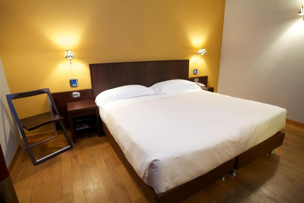 Postel nebo postele na pokoji v ubytování Hotel Dei Vicari
