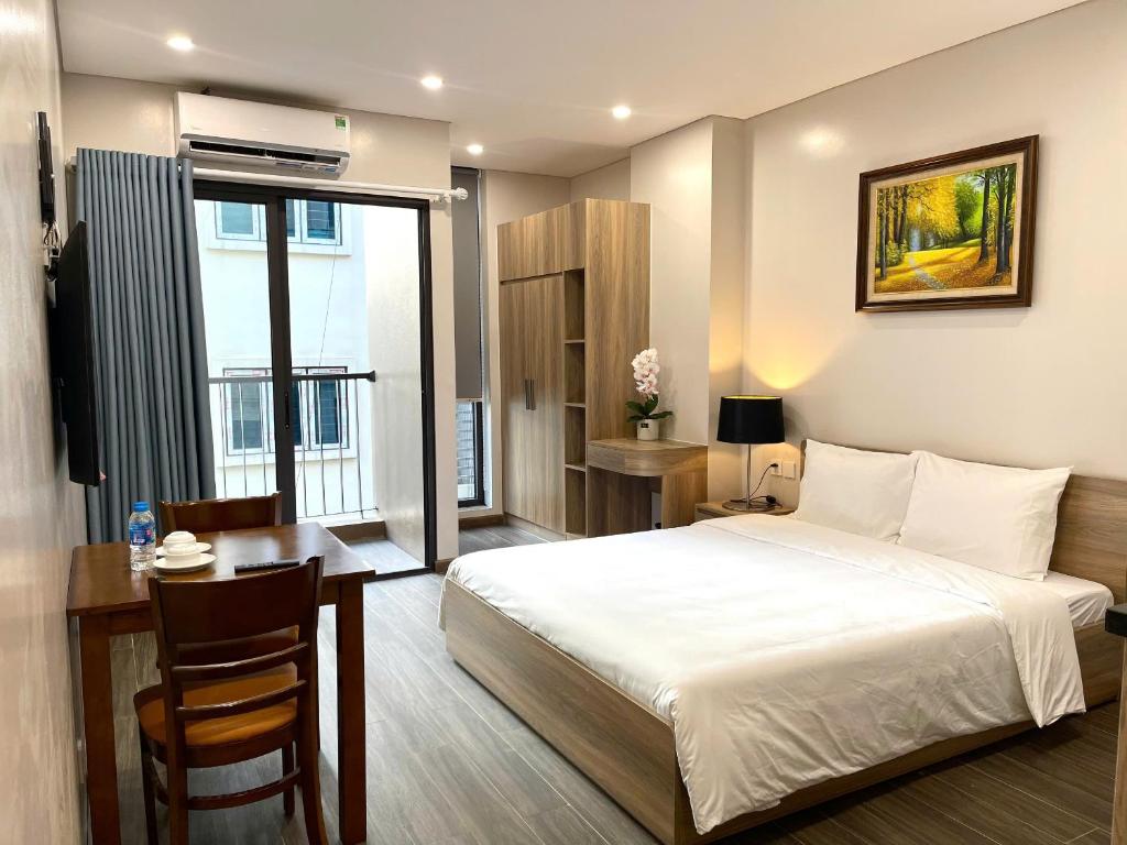 Giường trong phòng chung tại Fumi Residence Hanoi