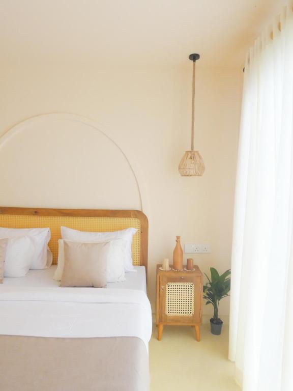 Giường trong phòng chung tại Samudrá Ahangama