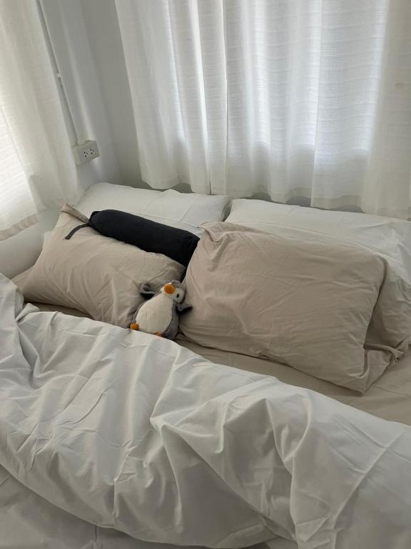 Postel nebo postele na pokoji v ubytování T-home Maerim