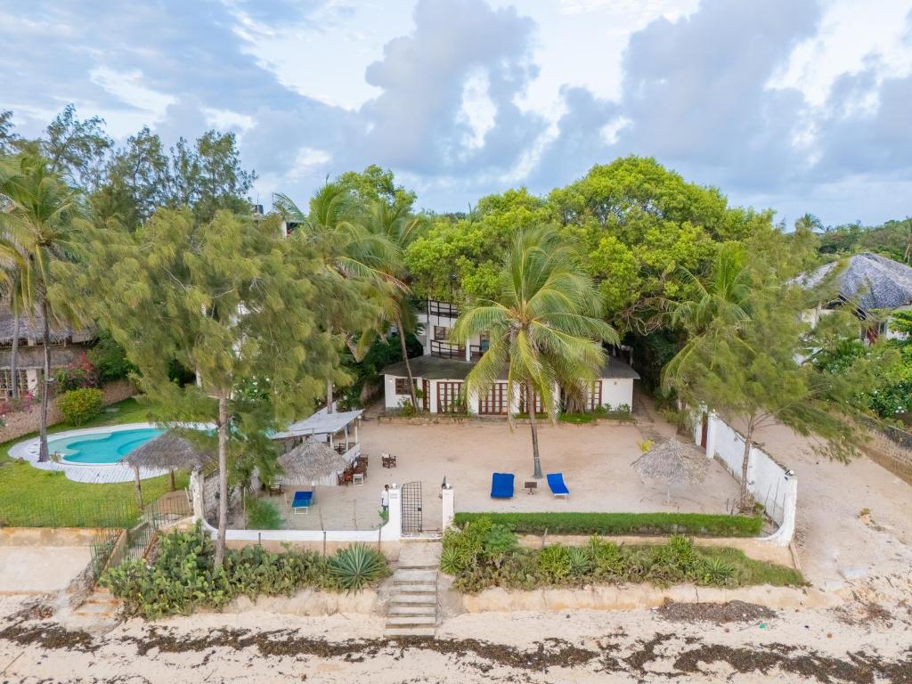 an aerial view of a house with a pool and trees at Silver Residence Apartments by MOKAWA in Malindi