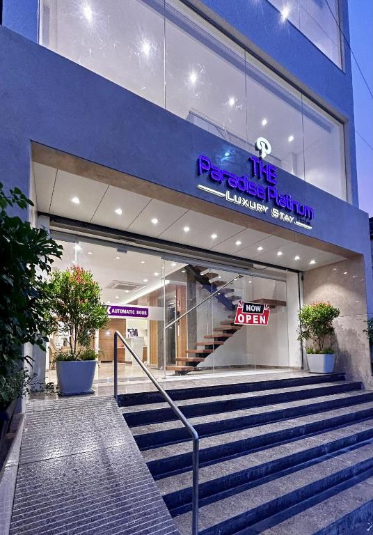 a store front with stairs in front of a building at The Paradise Platinum in Kanchipuram