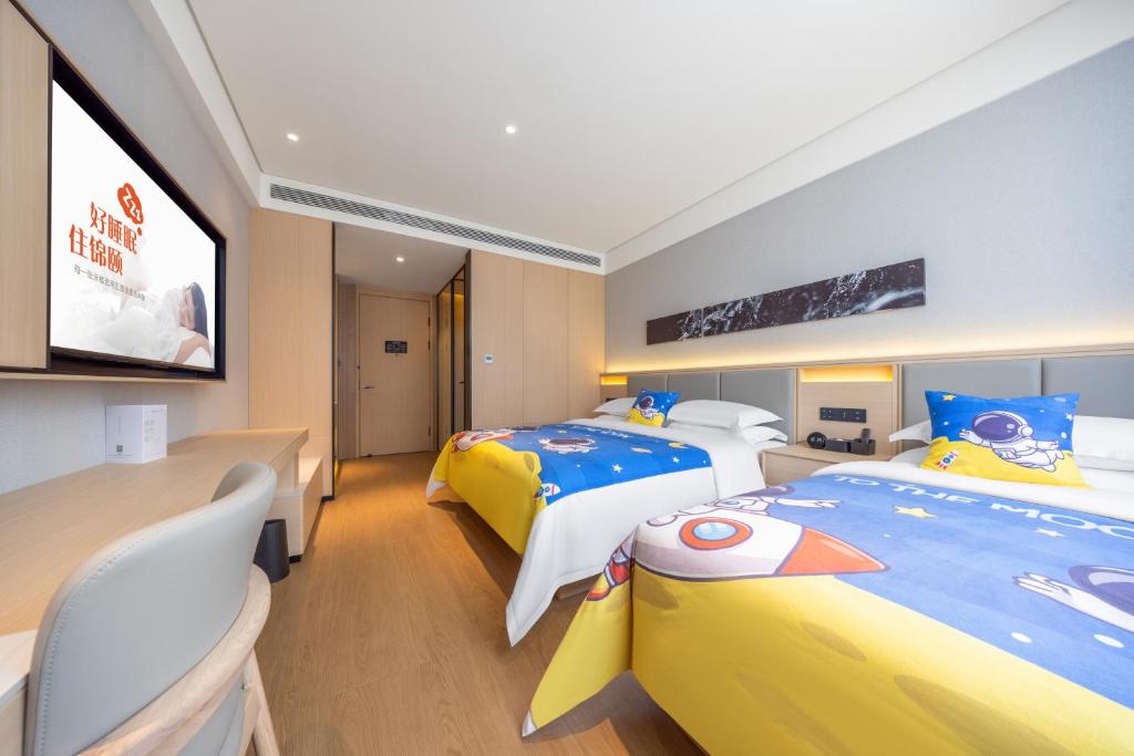 Una cama o camas en una habitación de Jin Yi Hotel, Ordos Dongsheng District Branch