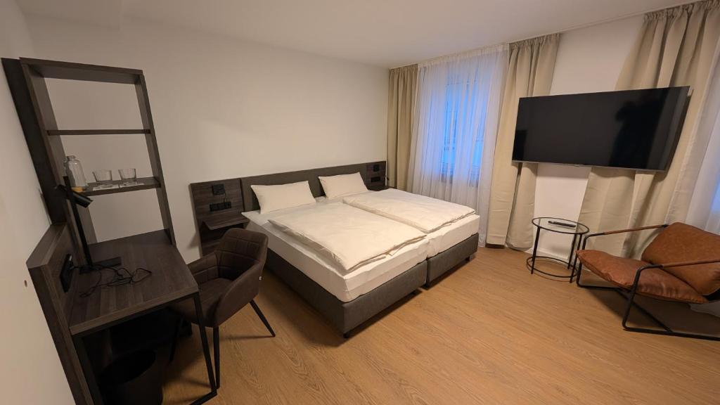 Postel nebo postele na pokoji v ubytování Müllerbräu Braugasthof