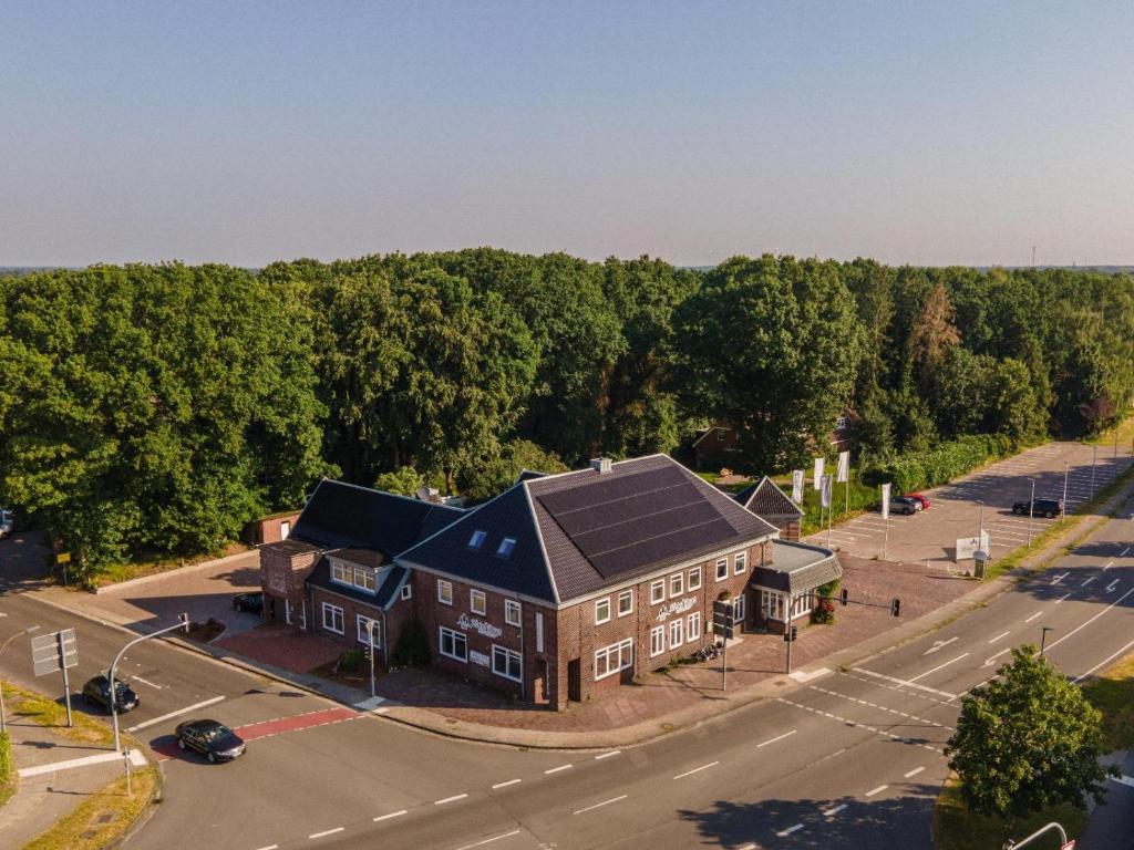 an aerial view of a house with a solar roof at Ferienwohnung Hotel Preyt in Holtland