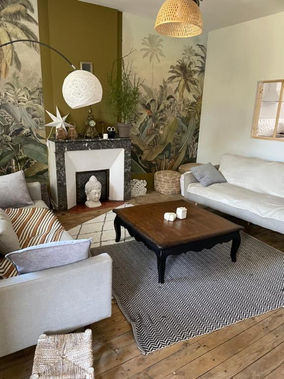 a living room with a couch and a coffee table at Maison avec Jardin 3 chambres entre Tarn et Aveyron in Carmaux