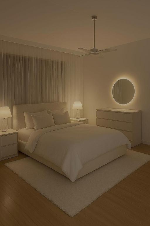 En eller flere senge i et værelse på CR Cozy Suites