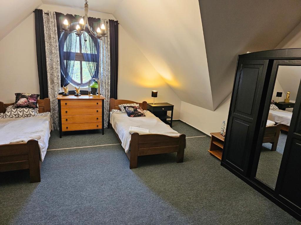 Postel nebo postele na pokoji v ubytování Pokój 106 rodziny Superior