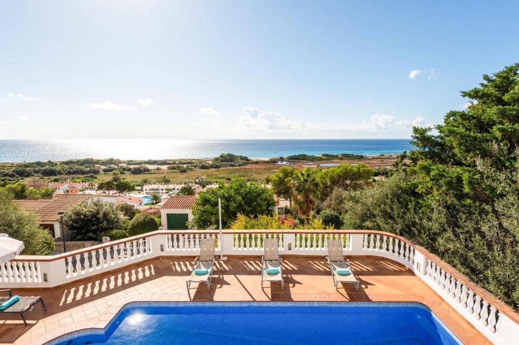 a view of the ocean from a house with a swimming pool at Villa Casa Bonita by Villa Plus in Alaior