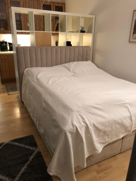 a bed in a bedroom with a white bedspread at Executive Apartment 2 in Bad Gastein