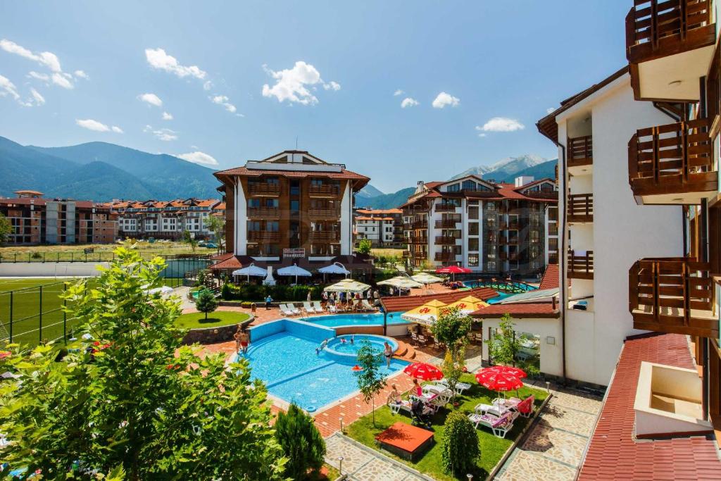 an aerial view of a resort with a swimming pool at Pirin's Hidden Gem BB & SKI & SPA in Bansko