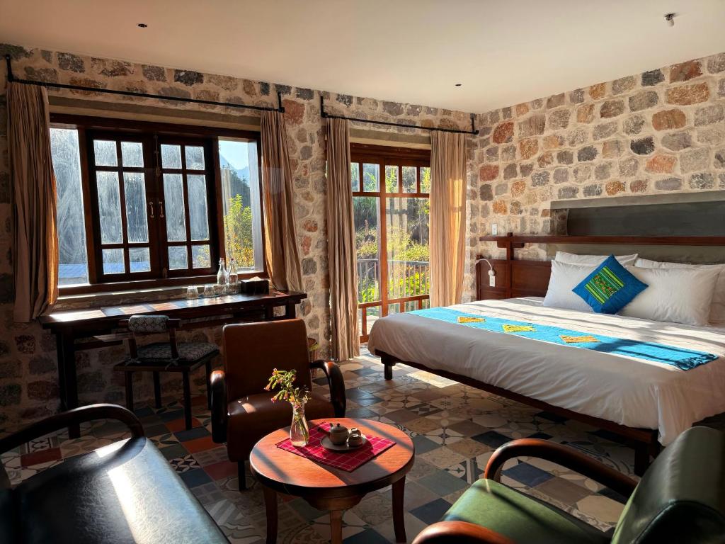 Giường trong phòng chung tại Ha Giang Aya Lodge by Localvietnam