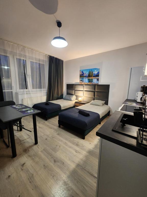Postel nebo postele na pokoji v ubytování Pokoje u Julii Premium Apartments