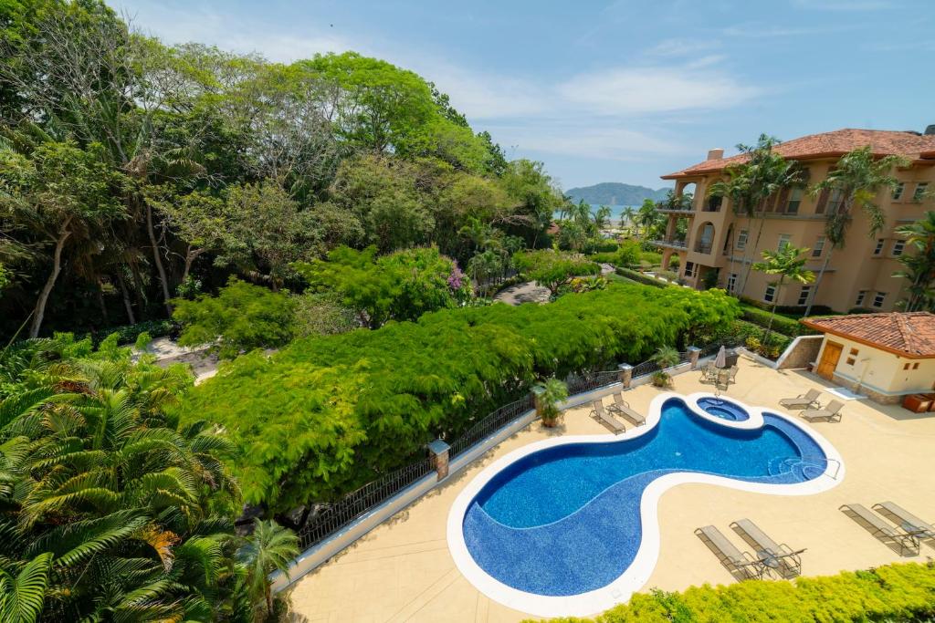 an aerial view of a swimming pool at a resort at Bella Vista 8B 3 bedr 3 1 and half bath in Jacó