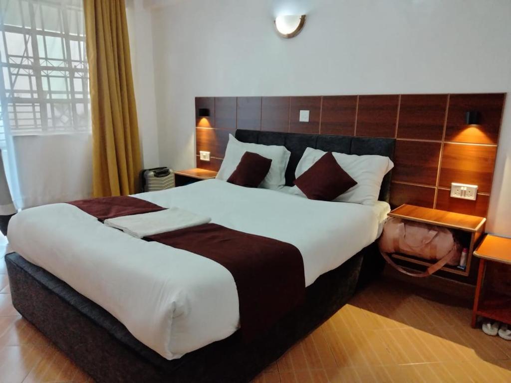 Ένα ή περισσότερα κρεβάτια σε δωμάτιο στο Dominion castle hotel