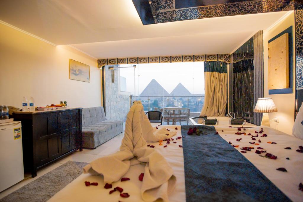 a living room with a couch and a table at Giza Inn Comfort view in Cairo