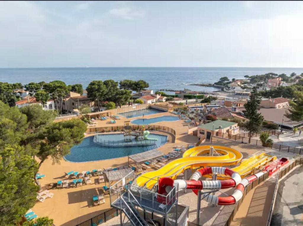 an amusement park with a water park with slides at Camping carry le rouet Lou Soulei in Carry-le-Rouet