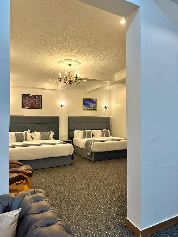 Postel nebo postele na pokoji v ubytování Calian Hotel