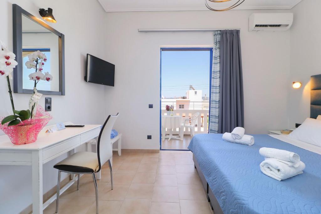 Postel nebo postele na pokoji v ubytování Alexis Hotel