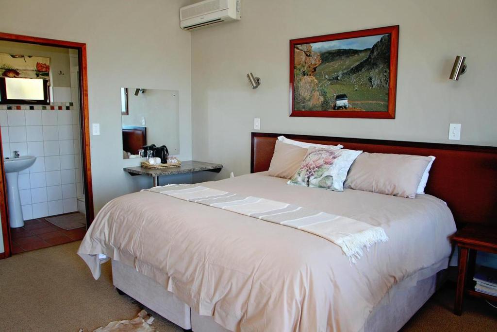 Ένα ή περισσότερα κρεβάτια σε δωμάτιο στο The Kumma