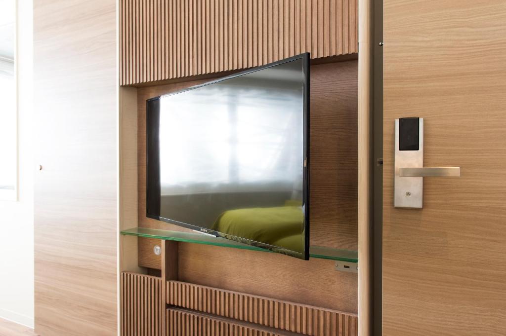 TV a/nebo společenská místnost v ubytování remm Roppongi