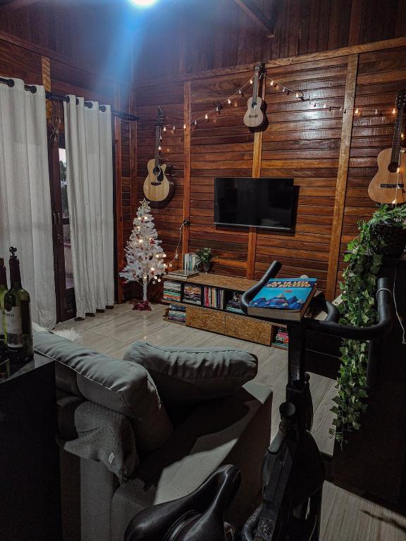 Et tv og/eller underholdning på Casa com Piscina em Balneário Piçarras