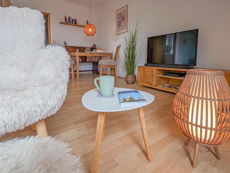 a living room with a couch and a coffee table at Refugium - Möhneseeblick in Möhnesee