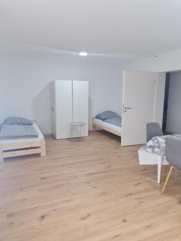 Ένα ή περισσότερα κρεβάτια σε δωμάτιο στο Zimmer-Leutkirch