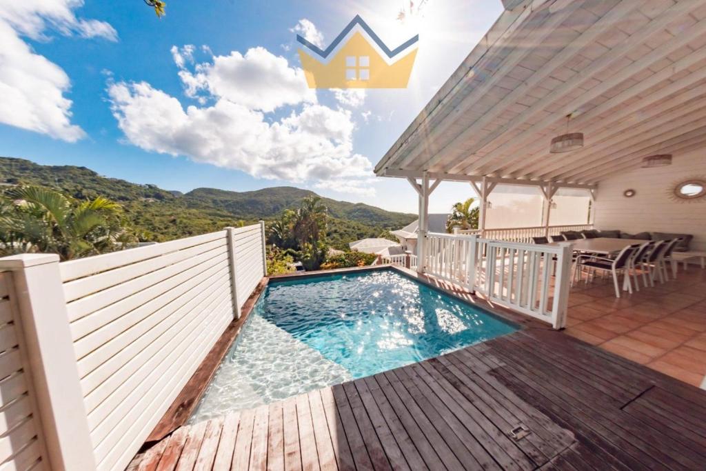 an image of a swimming pool in a house at La Villa du soleil in Les Trois-Îlets