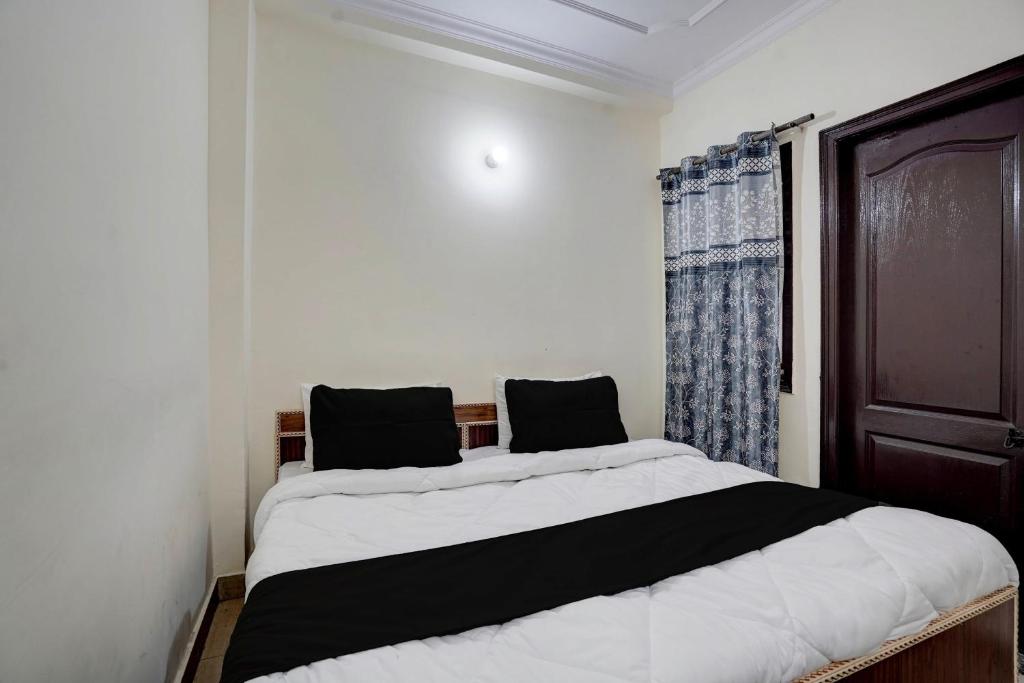 Ένα ή περισσότερα κρεβάτια σε δωμάτιο στο Hotel O Peaceful Paradise