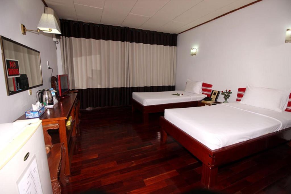 Letto o letti in una camera di Myanmar Life Hotel