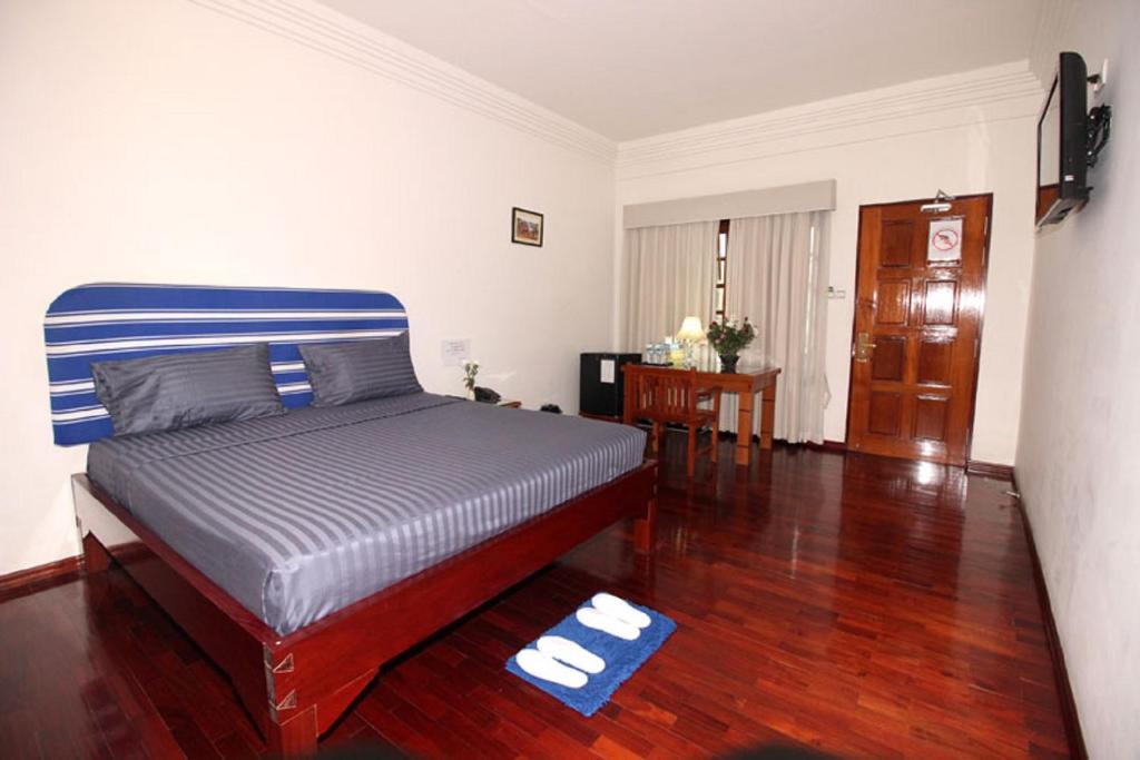 Letto o letti in una camera di Myanmar Life Hotel