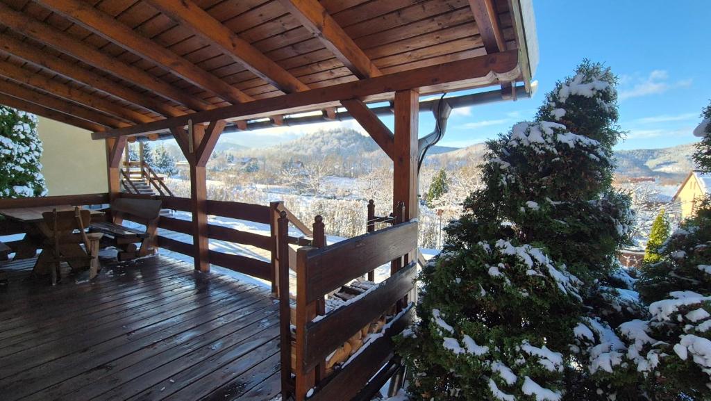 a wooden deck with a view of a mountain at Domek w Karkonoszach 1 pod Karpaczem in Karpacz